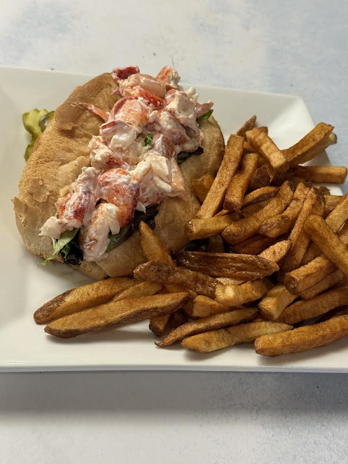 Maine lobster roll on a toasted roll served with hand-cut fries