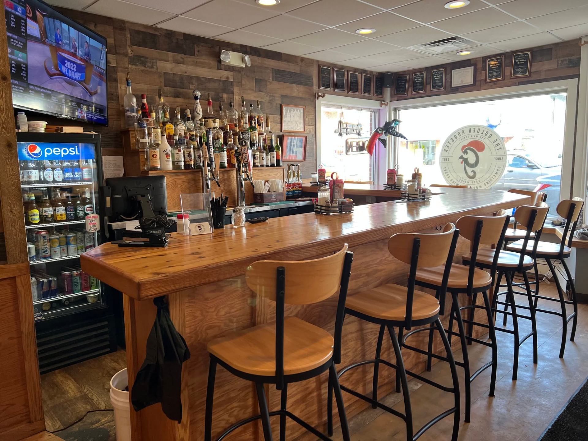 The indoor bar and dining room inside Golden Rooster in Saco, Maine